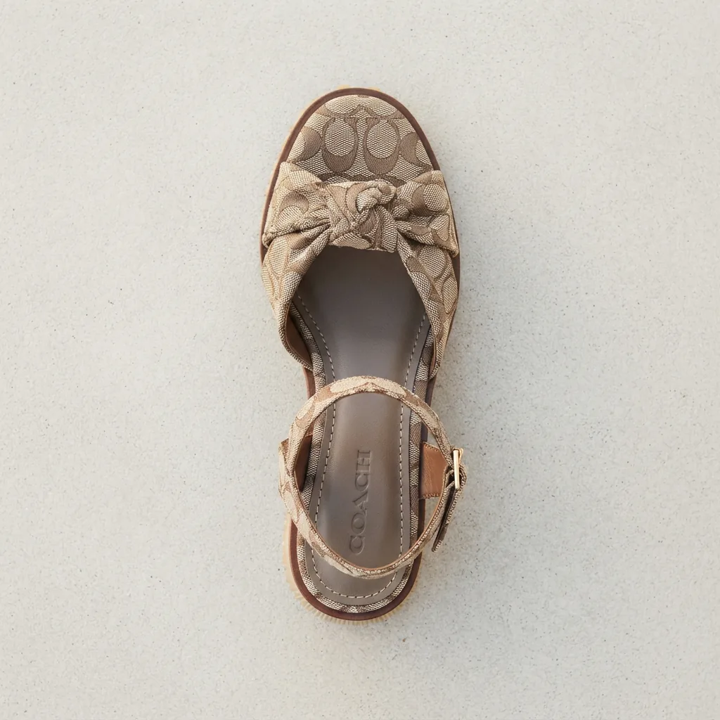 Coach Margot Sandal in signature jacquard, shown from a top view to highlight the patterned fabric.